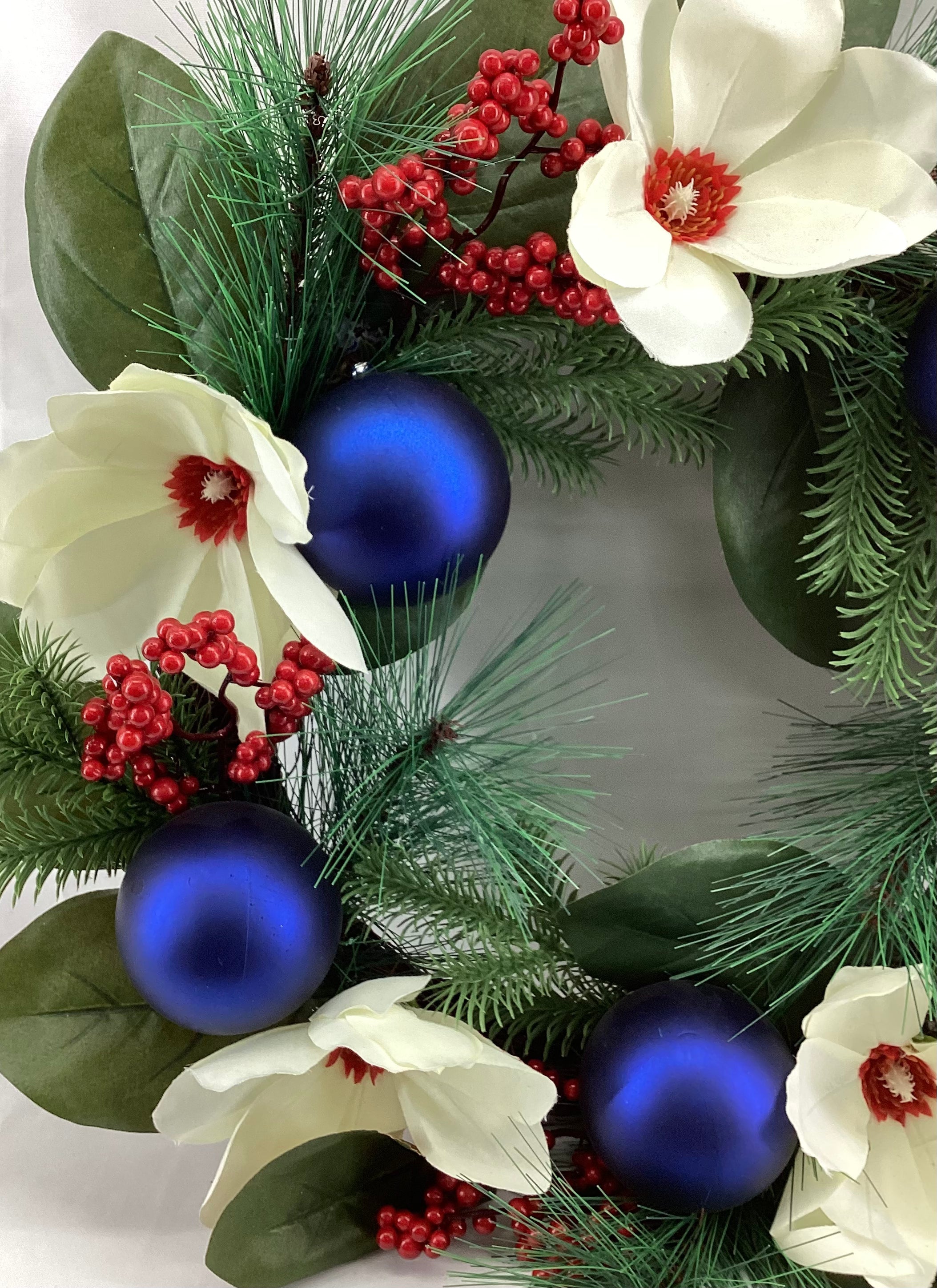 20” diameter Decorated  Wreath with blue shatterproof, white floral, berries
