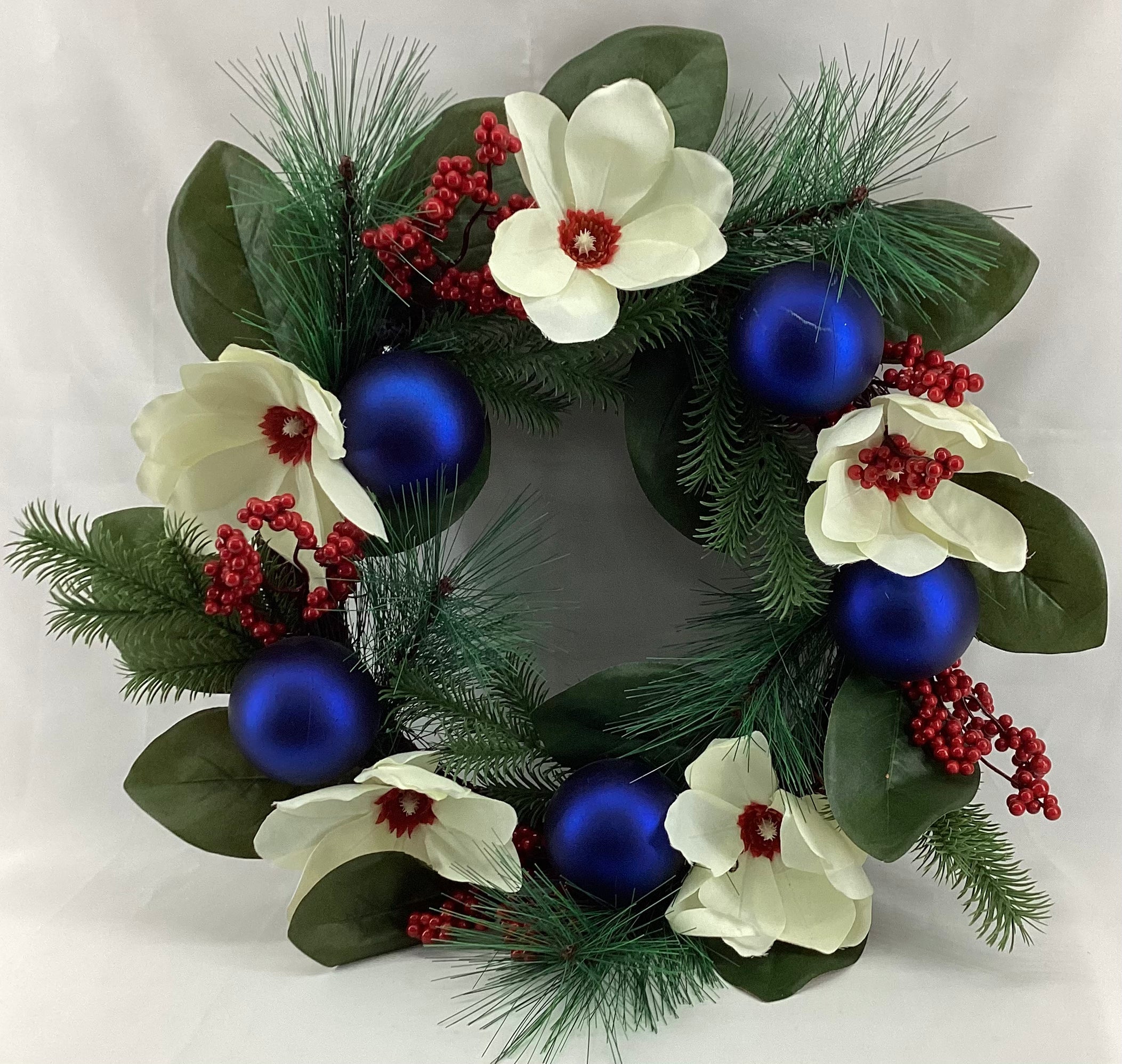 20” diameter Decorated  Wreath with blue shatterproof, white floral, berries