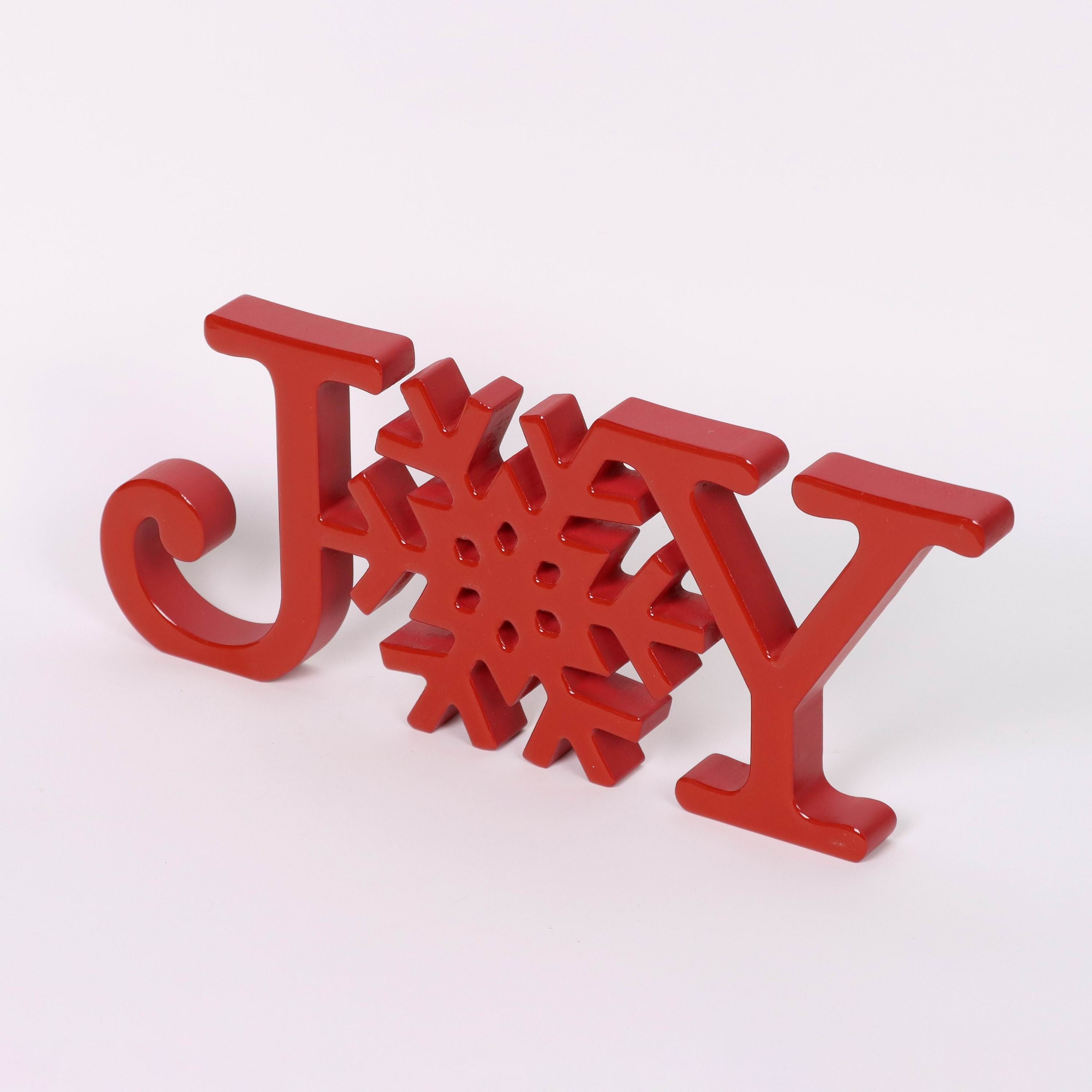 "JOY" red acrylic signage with snowflake